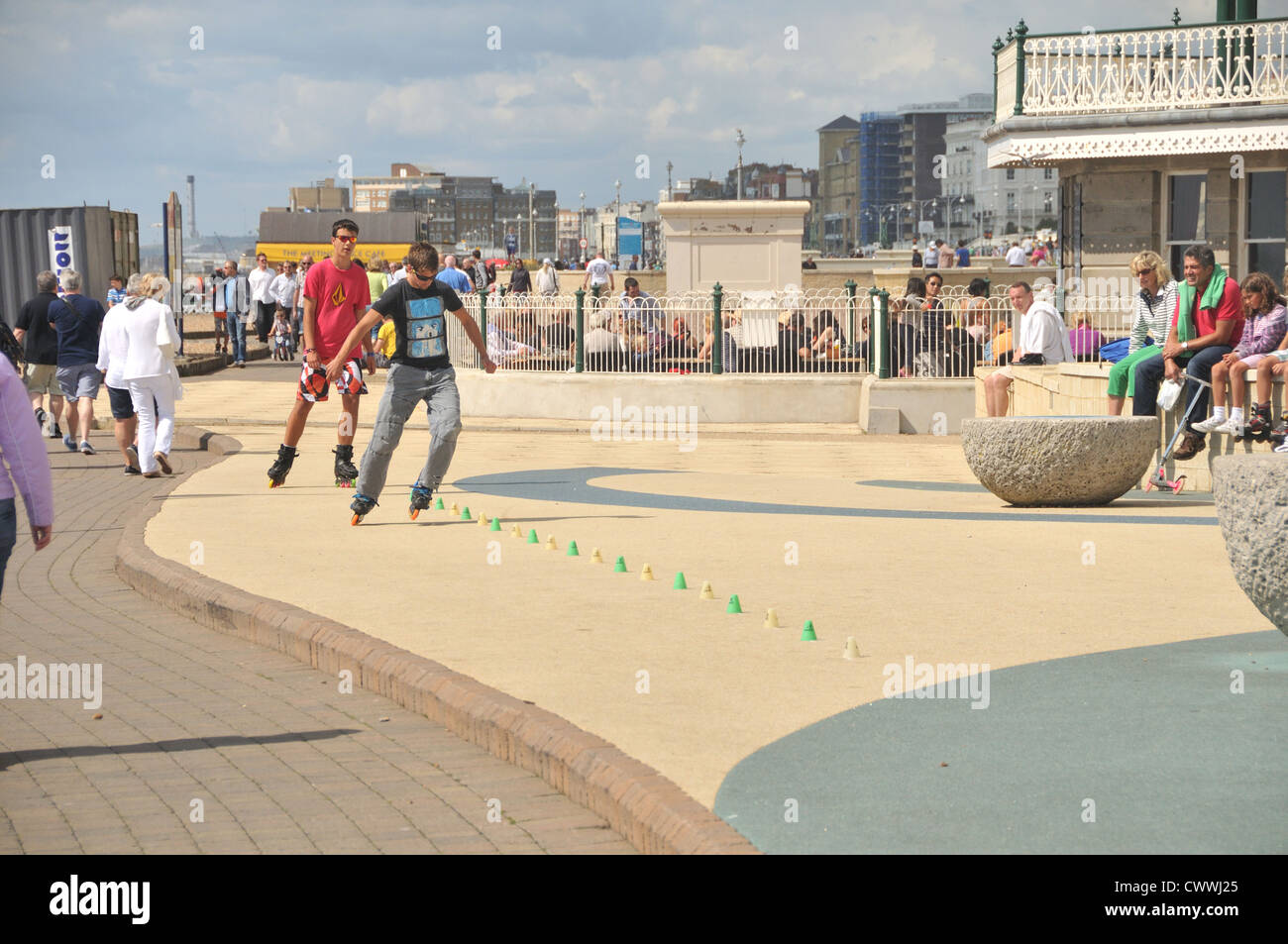 Busy Brighton and Hove seafront in summer (with the Brighton Bandstand
