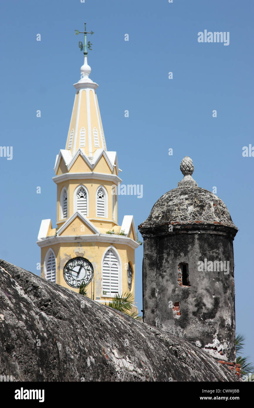Colonial church clock tower seen from city wall of the UNESCO [World Heritage Site] of Cartagena, Colombia South America Stock Photo