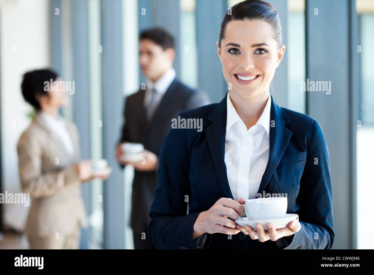 young businesswoman having coffee break at work Stock Photo Alamy