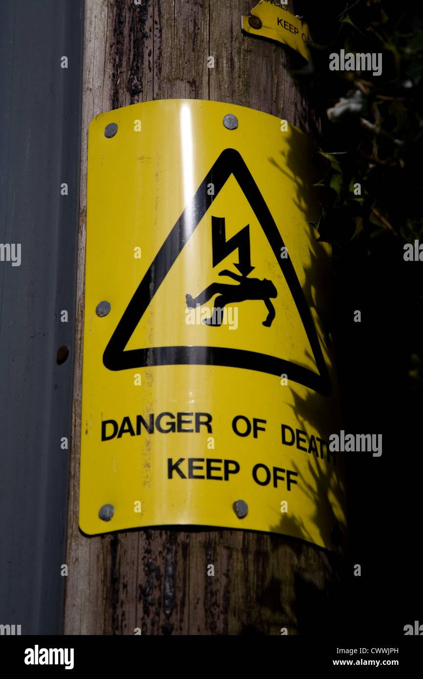Danger of Death sign on an electrical cable post Stock Photo