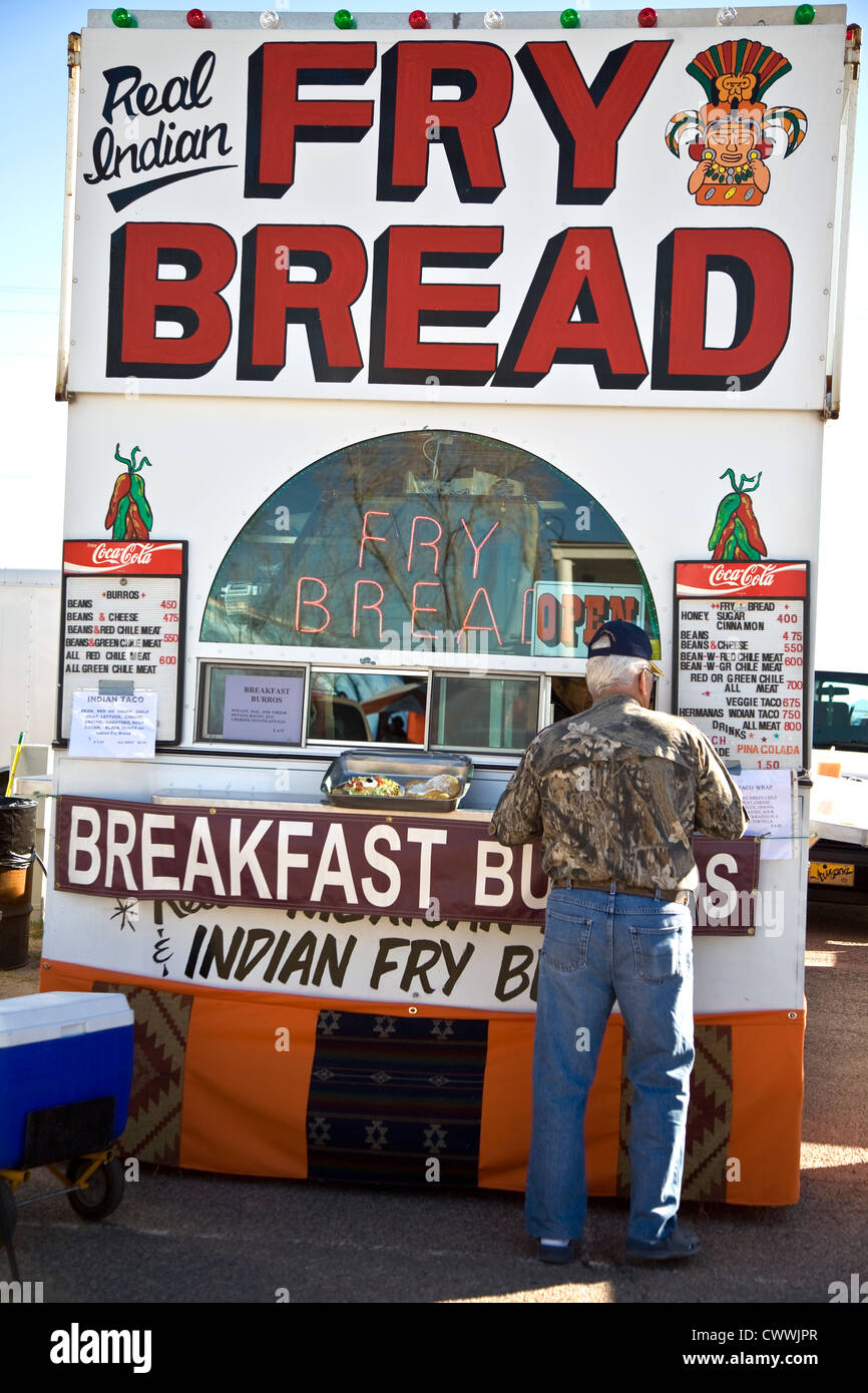 Man at the traditional Native American Fry Bread Food stall at the Gourd Show at the fairground near Wuertz Farm Arizona USA Stock Photo