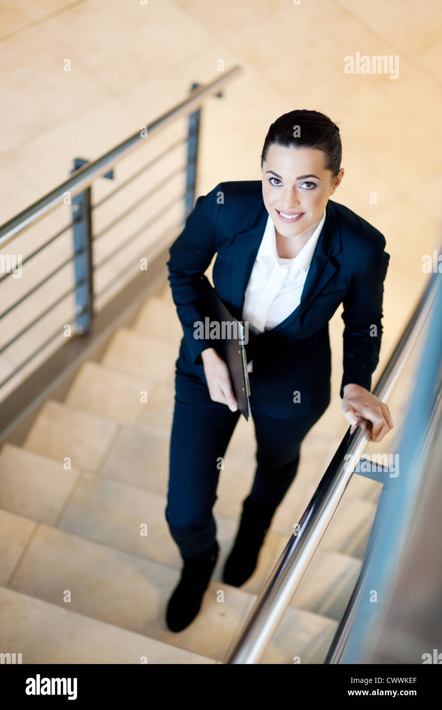 gorgeous young businesswoman walking up stairs Stock Photo - Alamy