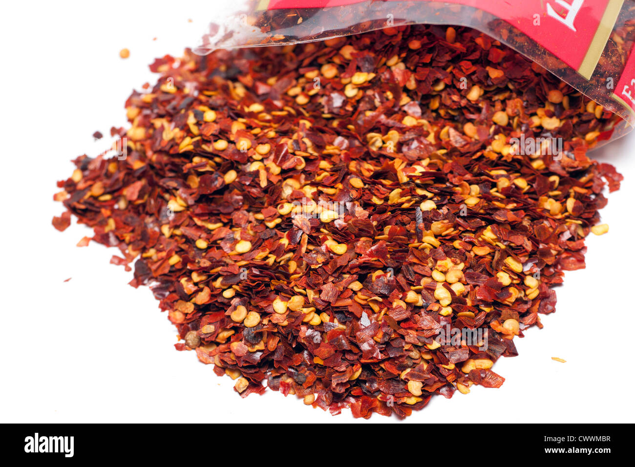 Pile of crushed chilli on a White Background Stock Photo - Alamy