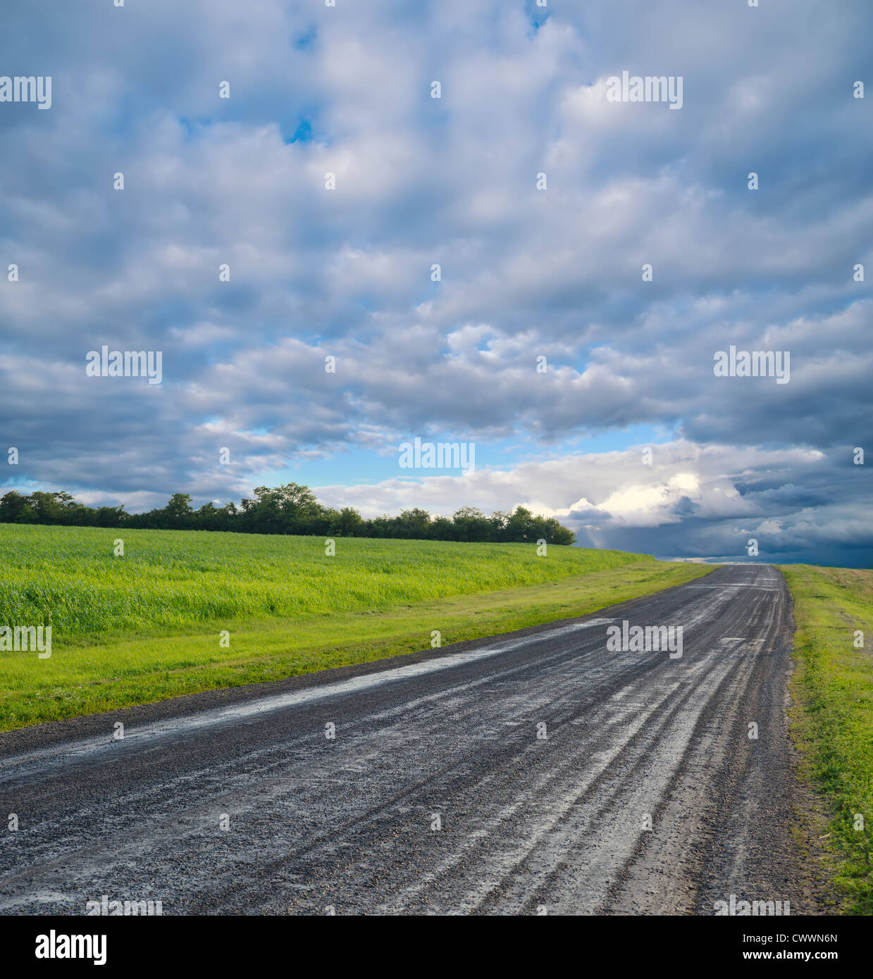 rural road and stormy clouds Stock Photo - Alamy