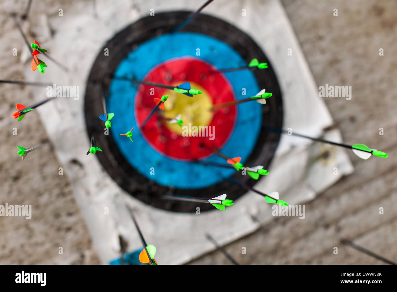 Archery - numerous arrows in a target Stock Photo