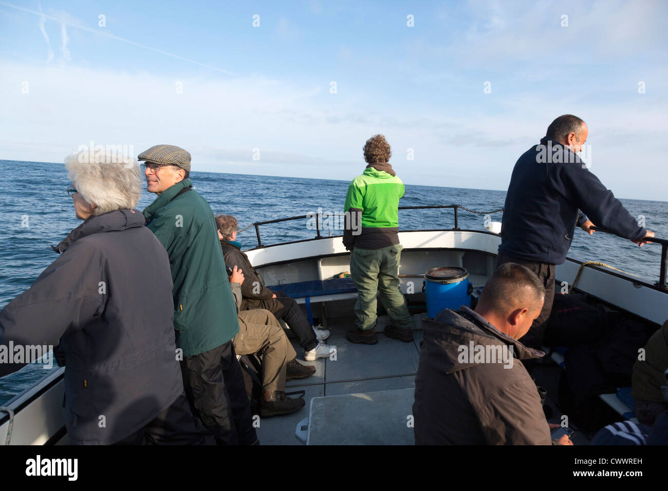 People on a Pelagic Trip looking for birds; UK Stock Photo