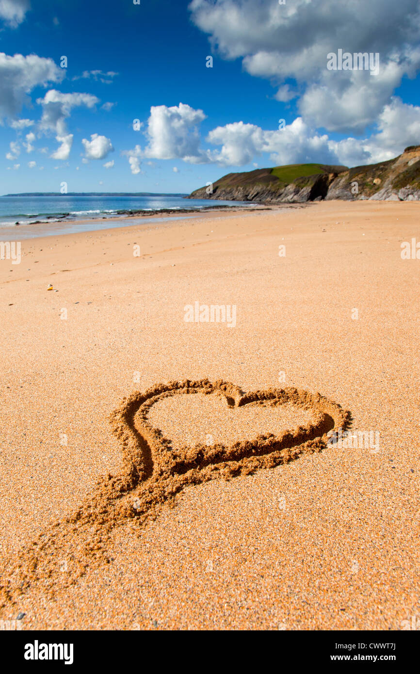 Porthbeor Beach; St Antony; St Just in Roseland; Cornwall; UK; heart in the sand Stock Photo