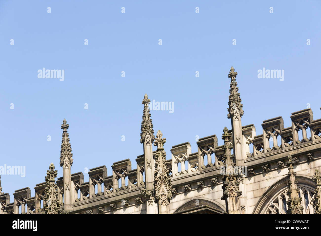 Details of stone finials and parapet carvings on the nave roofline of ...