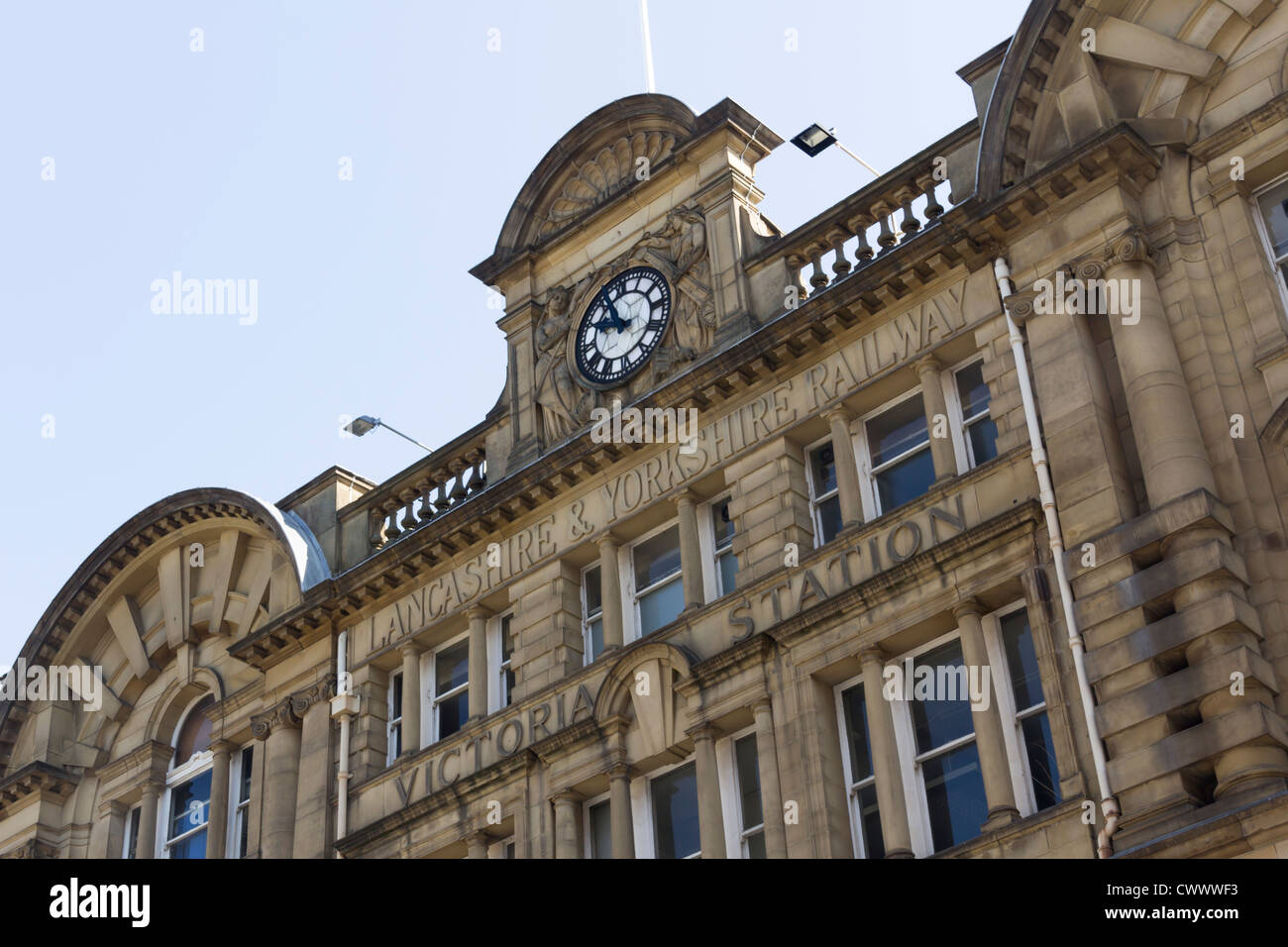 Main facade of Manchester Victoria railway station showing the clock and  Lancashire and Yorkshire Railway inscription. Stock Photo