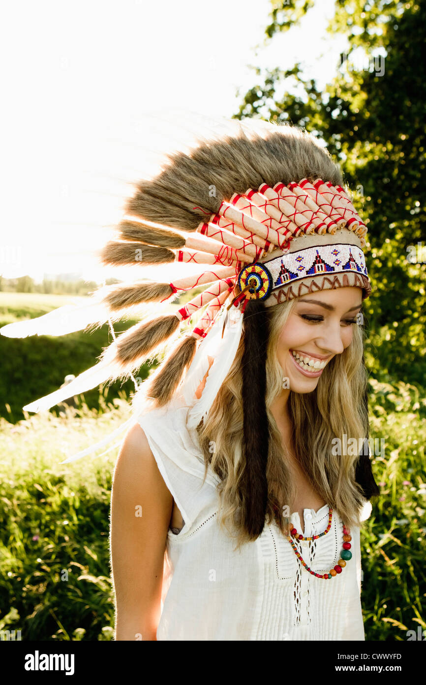 Woman wearing Native American headdress Stock Photo Alamy