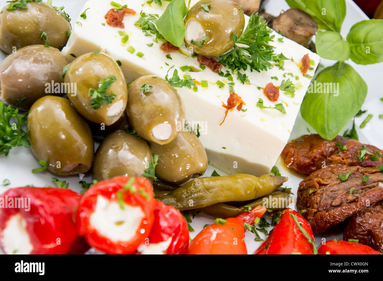 Different types of Antipasto on a plate against wood Stock Photo Alamy
