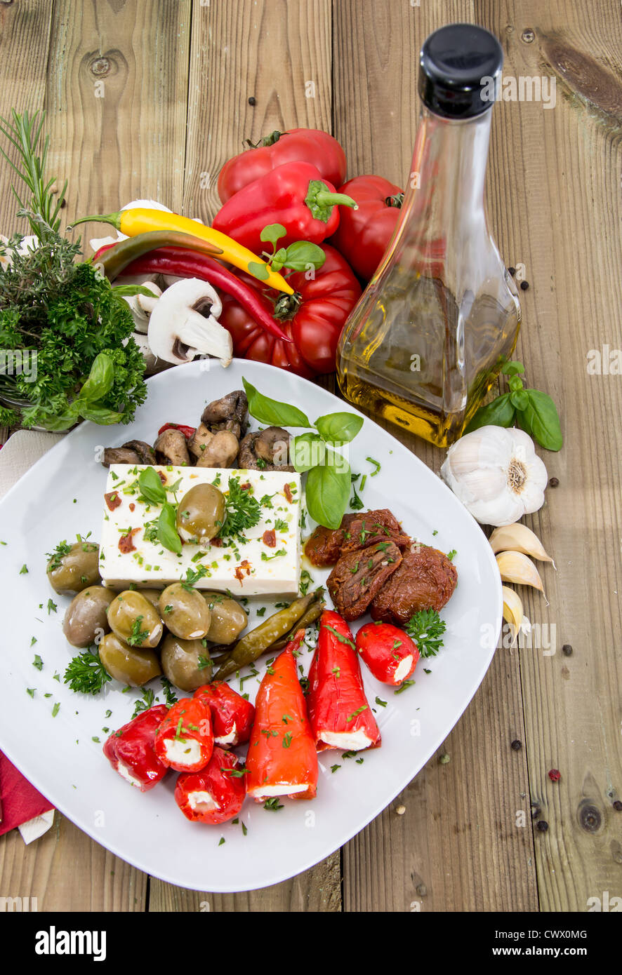 Different types of Antipasto on a plate against wood Stock Photo Alamy
