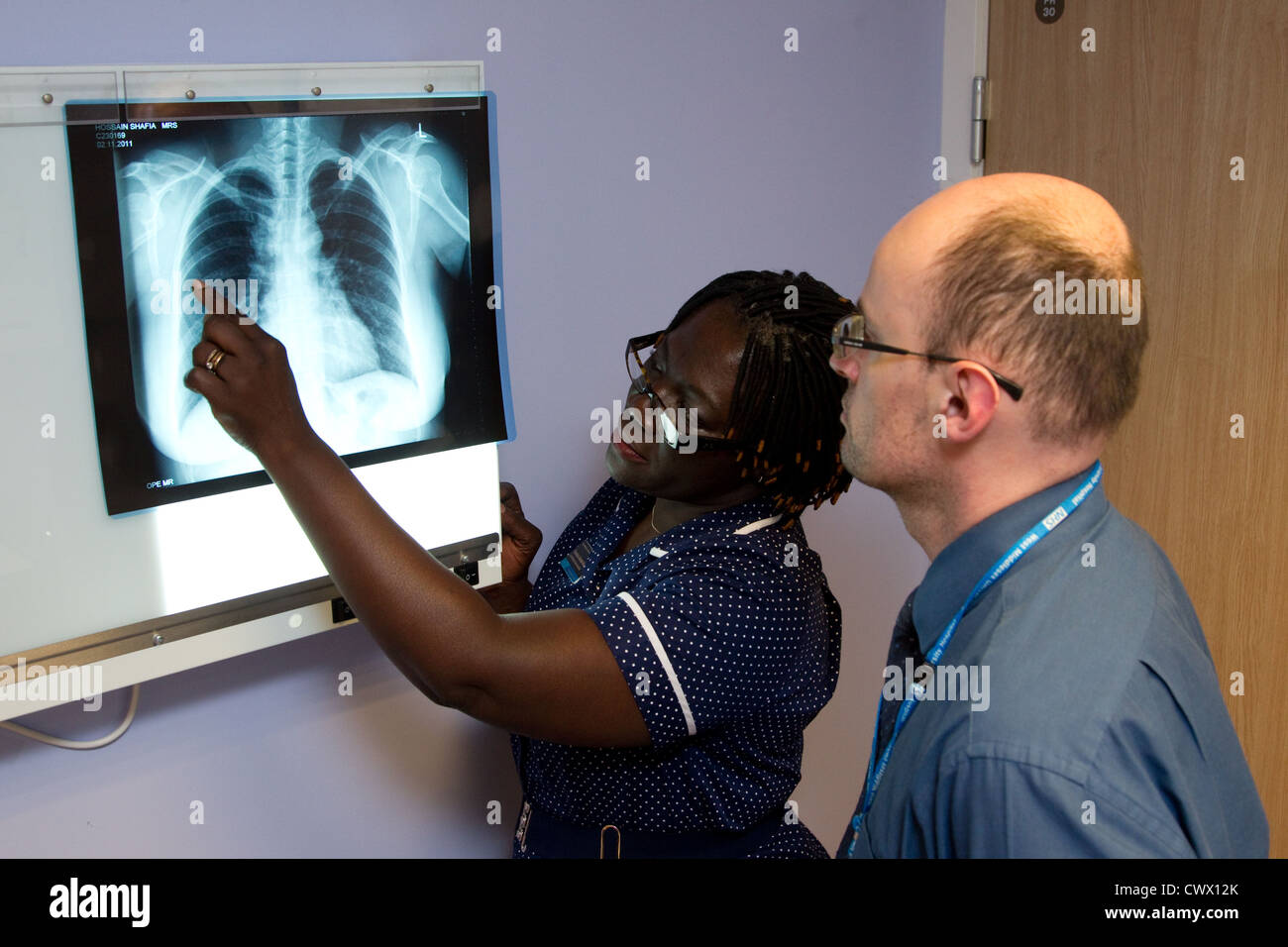 Sister and doctor looking at a chest Xray Stock Photo