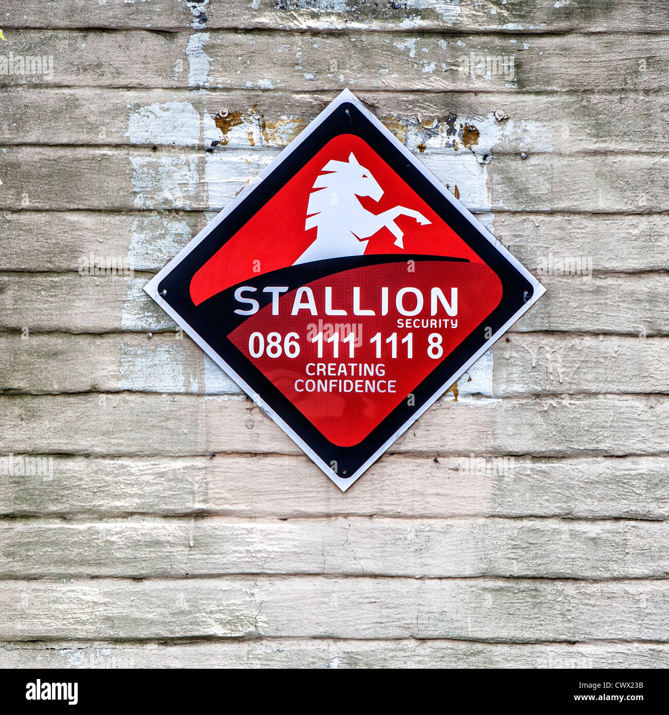Security sign on wall of Johannesburg home Stock Photo Alamy
