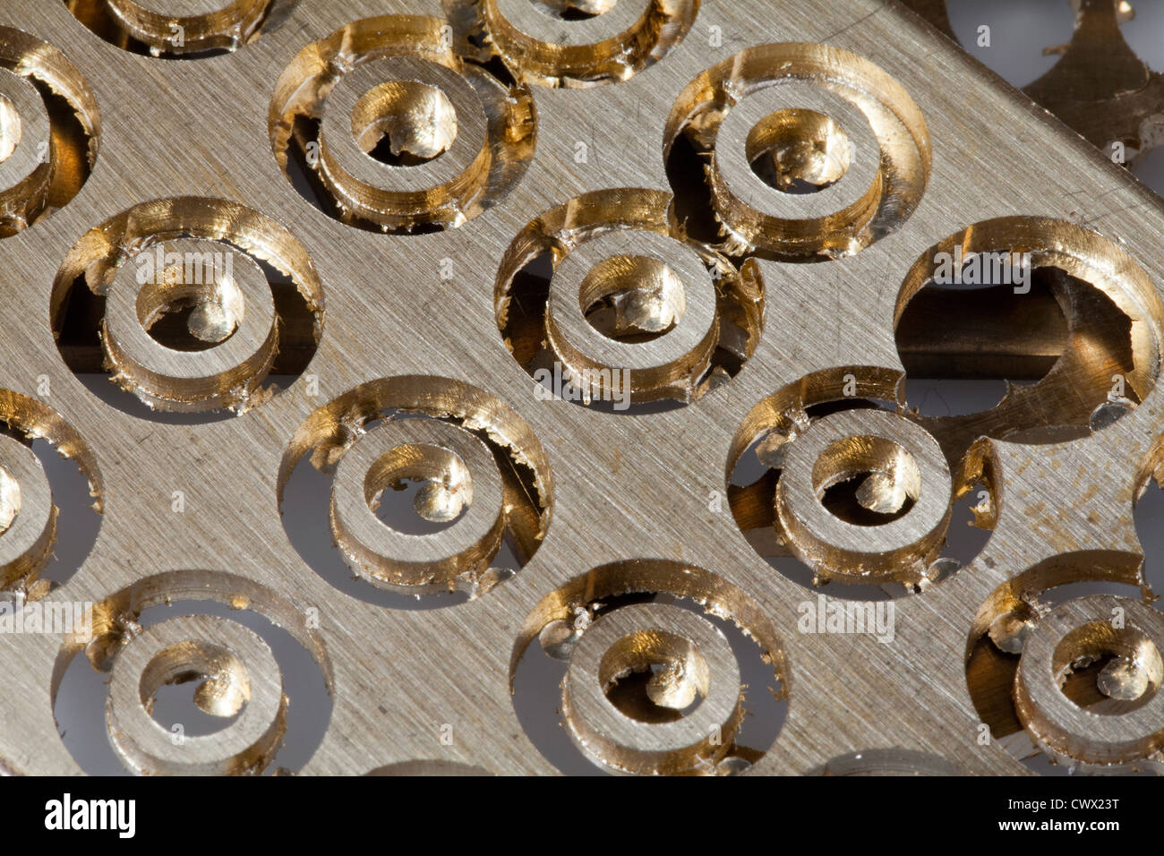Brass sheet with round holes, brass scrap Stock Photo