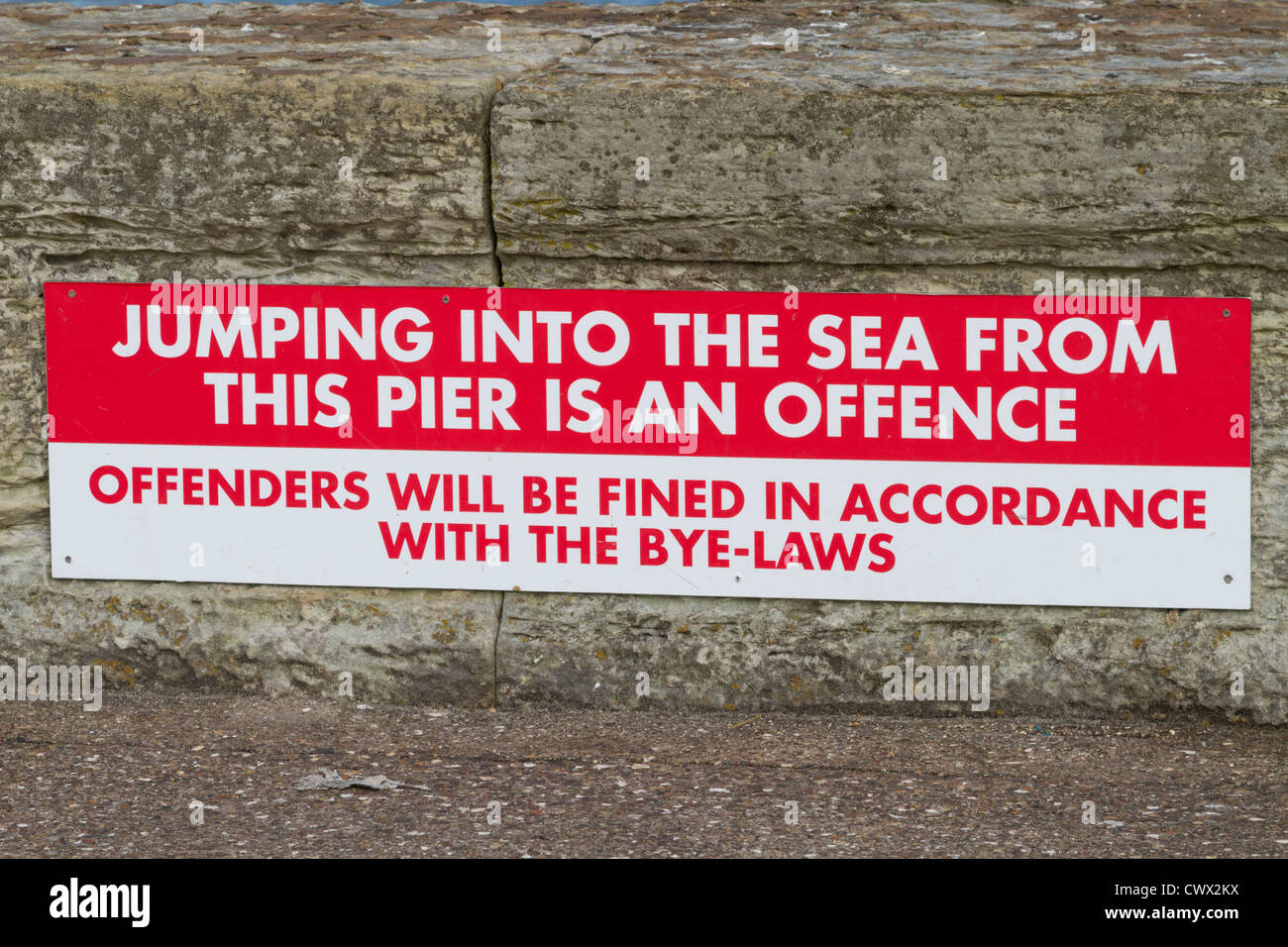 Seaside warning sign Stock Photo