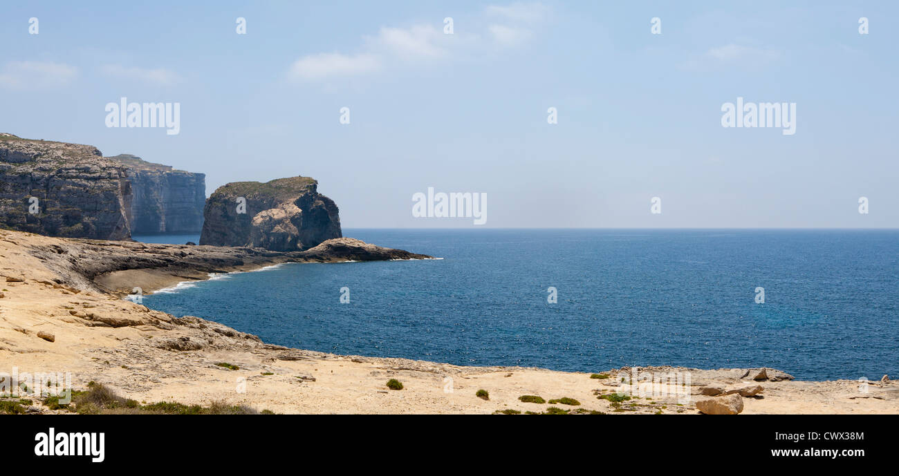 Panoramic shot of Fungus Rock, off Dwejra point close to the Azure Window, Il-Qawra, Island of Gozo, Mediterranean Sea Stock Photo