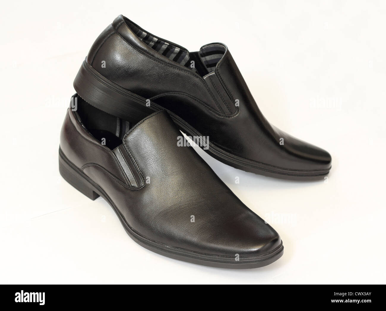 man's black shoes isolated on white background Stock Photo - Alamy