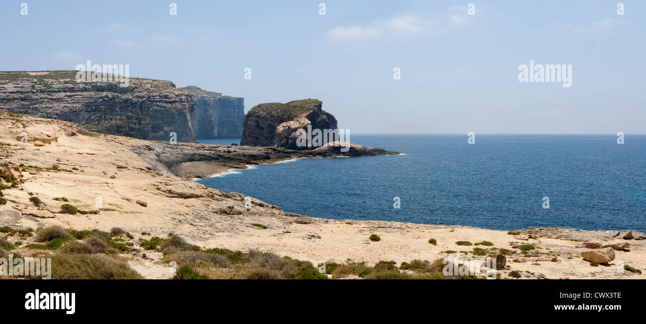 Panoramic shot of Fungus Rock, off Dwejra point close to the Azure Window, Il-Qawra, Island of Gozo, Mediterranean Sea Stock Photo