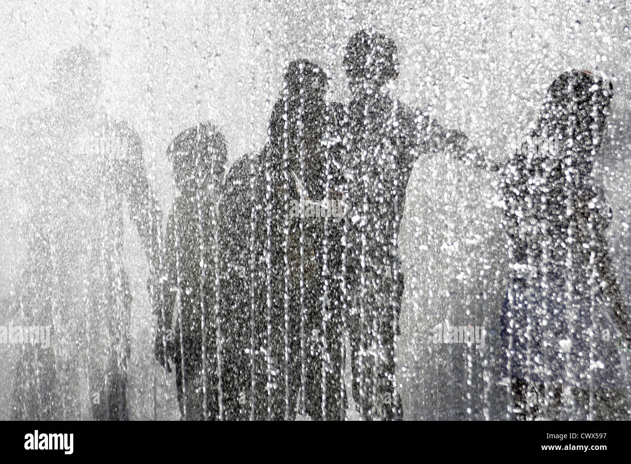 Silhouettes of figures in a fountain Stock Photo - Alamy