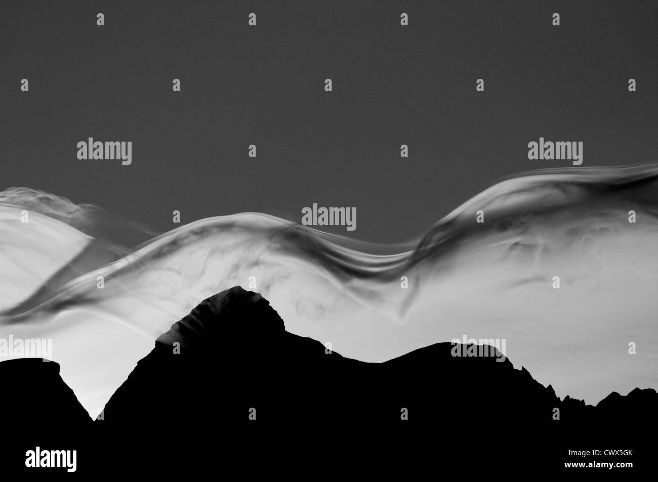 Lenticular clouds over the Jungfrau in the Bernese Alps in black and white Stock Photo