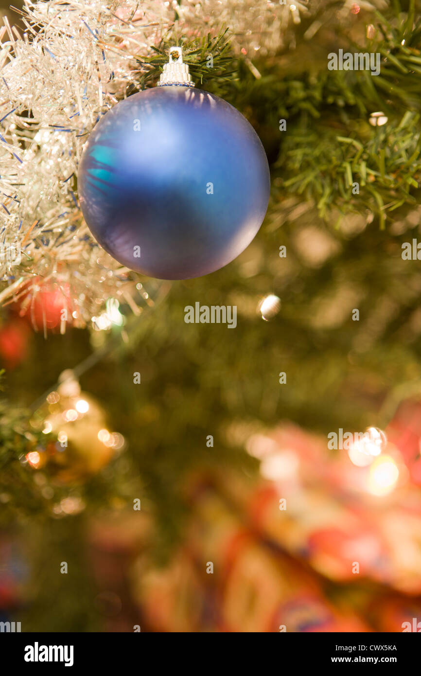 Blue Christmas ball in a tree Stock Photo - Alamy