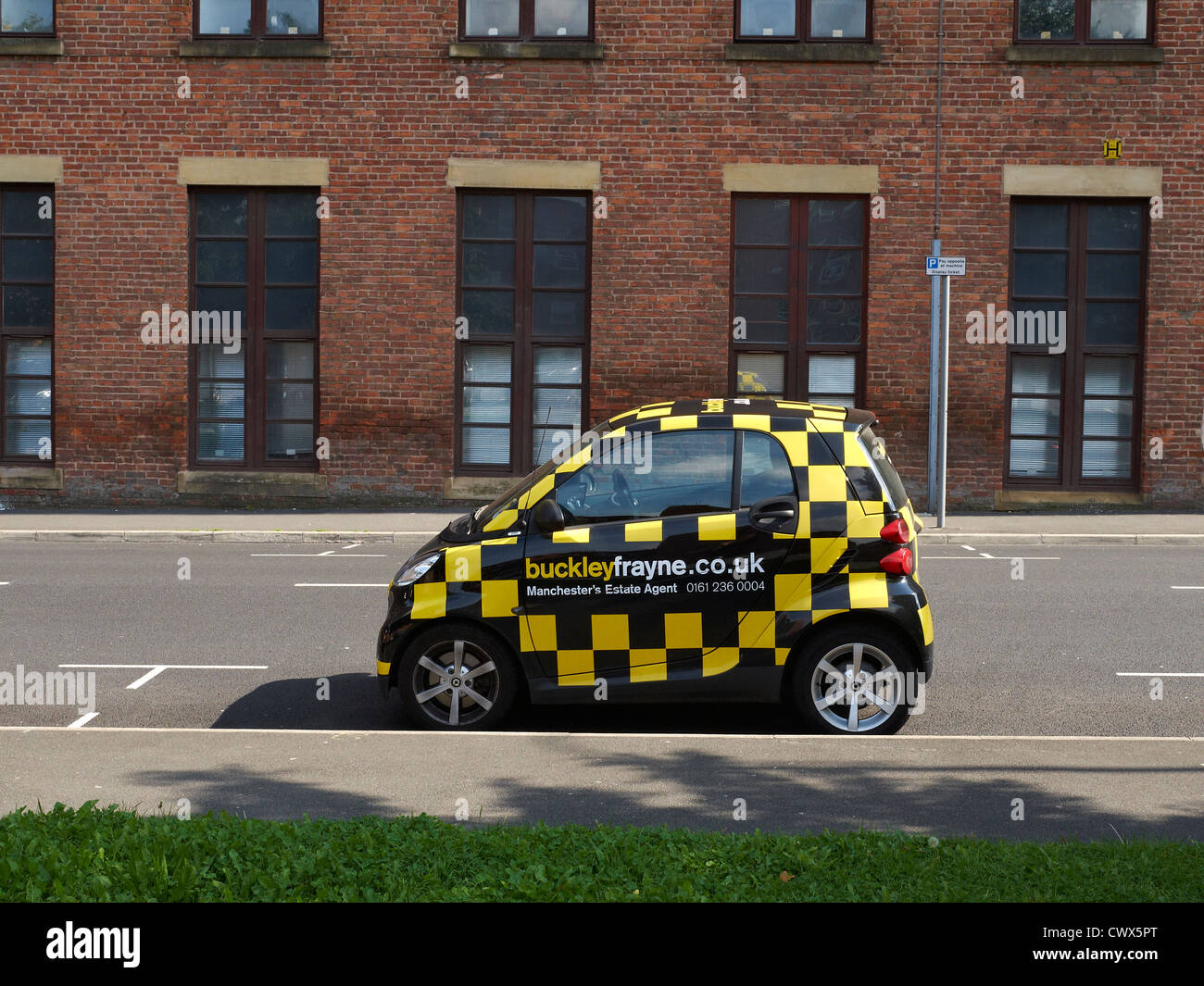 BuckleyFrayne Estate agent advertising on Smart car in Manchester UK Stock Photo