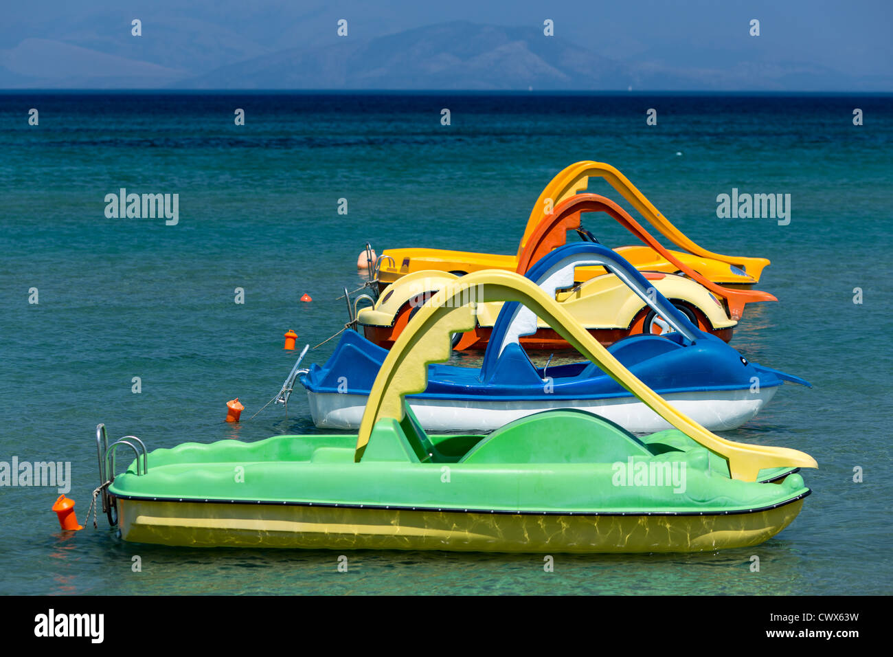 Colourful plastic paddle boats for rent in Moraitika, Corfu, Ionian