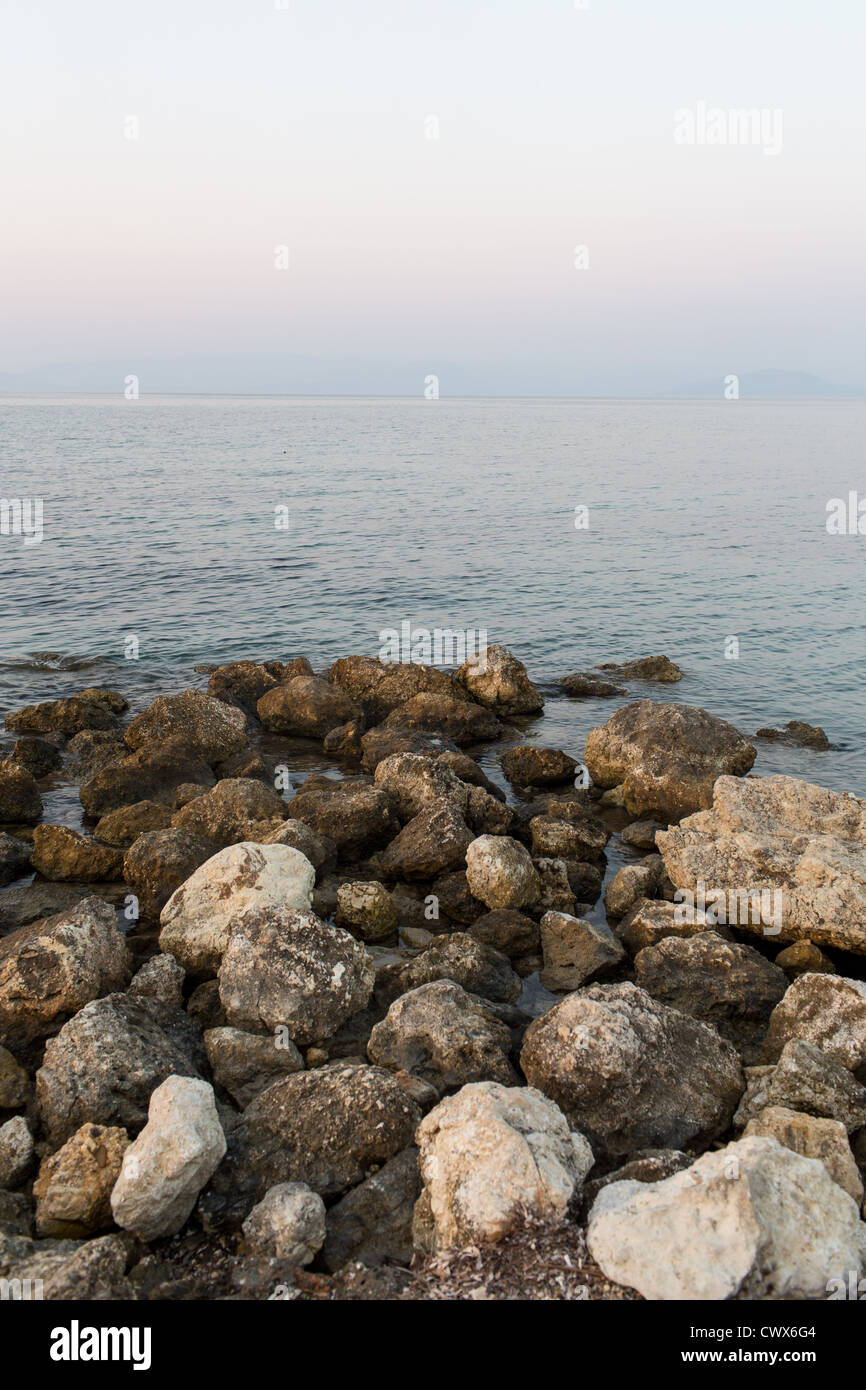 Rocks on an untamed coast in Moraitika, Corfu, Ionian Islands, Greece. Stock Photo