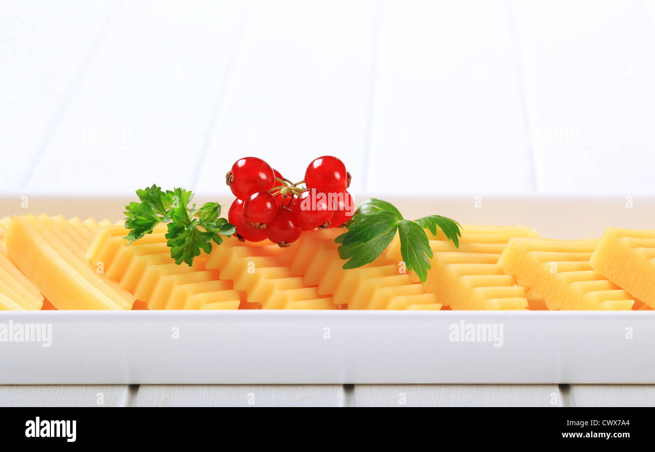 Hard cheese cut into triangles Stock Photo Alamy