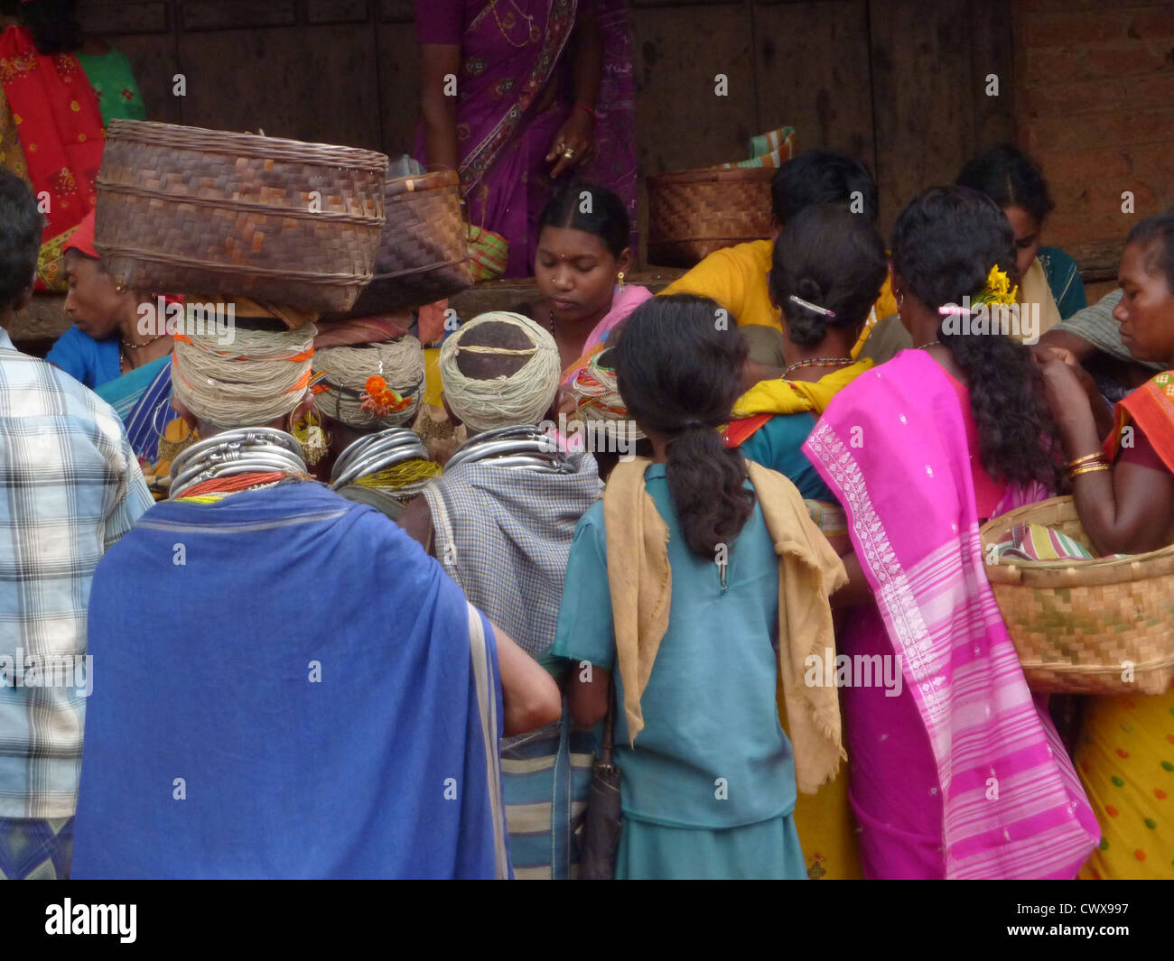 ORISSA, INDIA - NOV 12 -Bonda tribal women shop in the weekly market on Nov 12, 2009 in Ankadeli, Orissa in India  Stock Photo