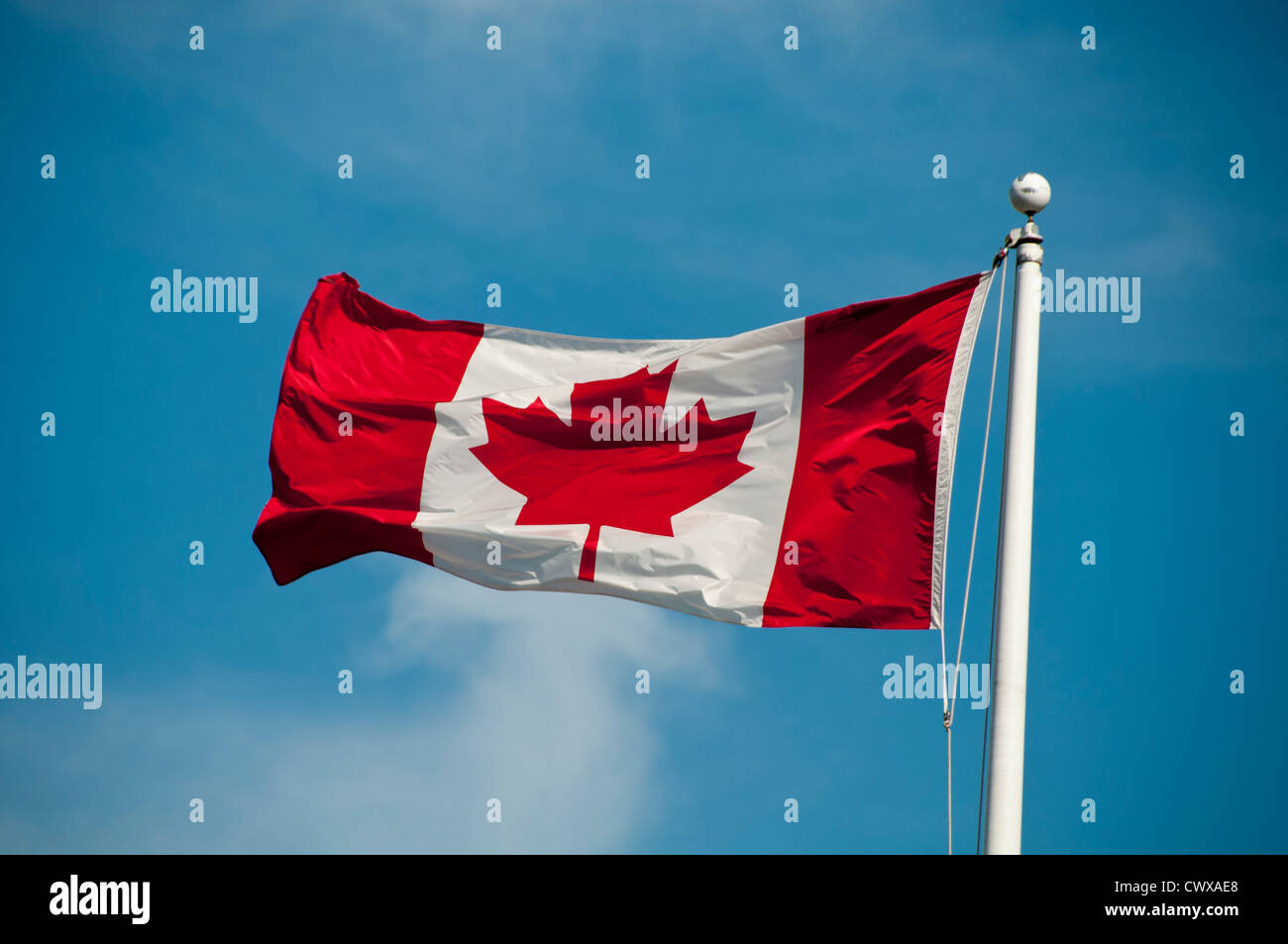 Canadian Flag against blue sky Stock Photo