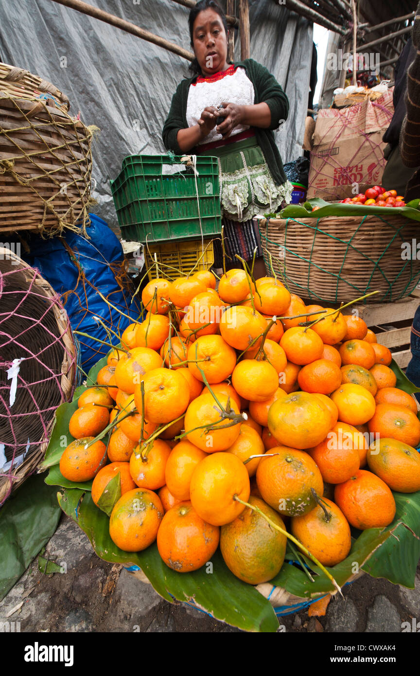 Orange vendor in local market, Chichicastenango, Guatemala. Stock Photo
