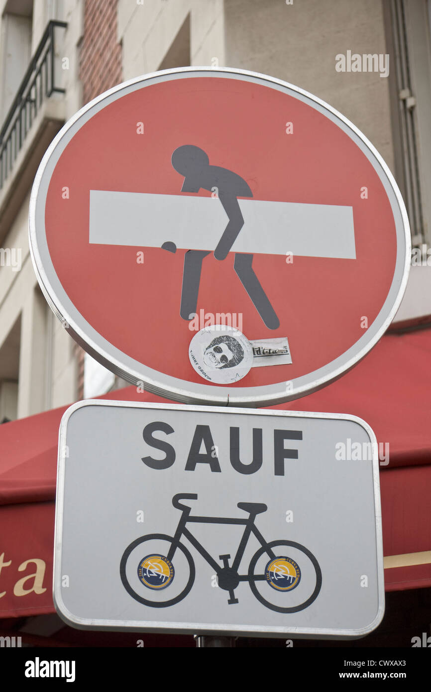 Curious road sign with artistic manipulation, Paris Stock Photo - Alamy