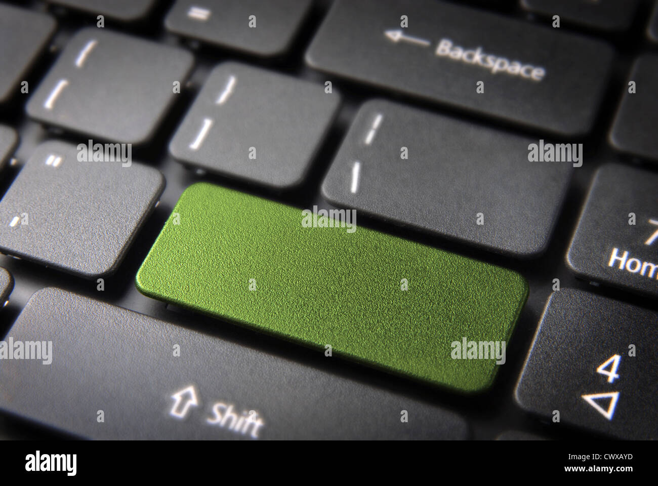 Green empty design key on laptop keyboard. Included clipping path, so you can easily edit it. Stock Photo