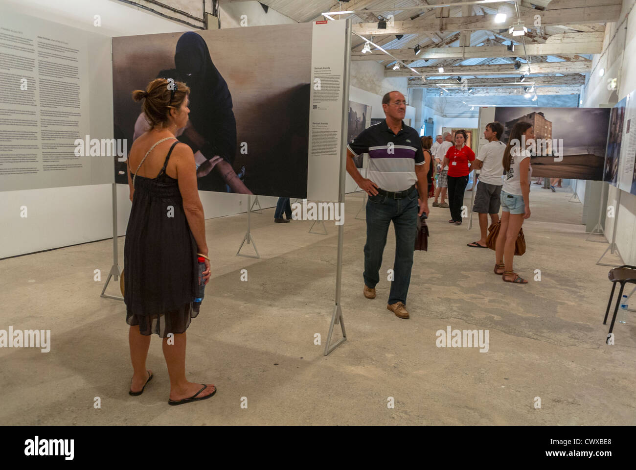 Perpignan, France,Tourists Visiting inside Exhibitions, at Visa Pour l'Image, International Photojournalist Photography Festival Stock Photo