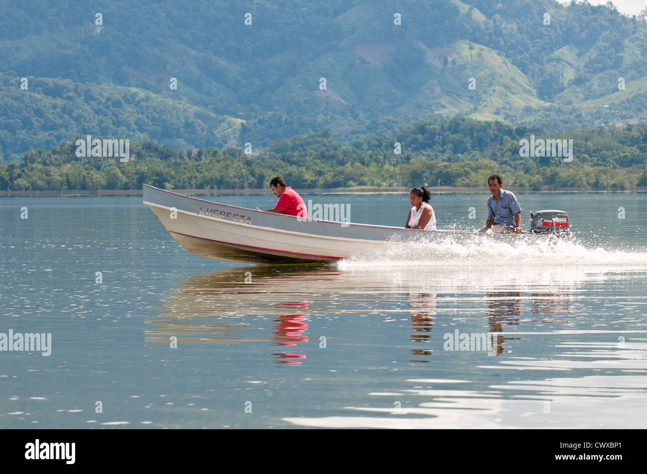 Guatemala, Lake Izabal. garifuna indigenous people in speed boat water taxi on Lake Izabal Lago de Izabal, Guatemala. Stock Photo