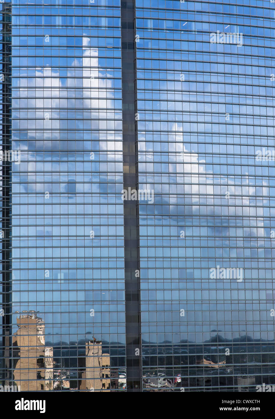 A cloud reflected on a modern steel and glass building in Houston, Texas Stock Photo