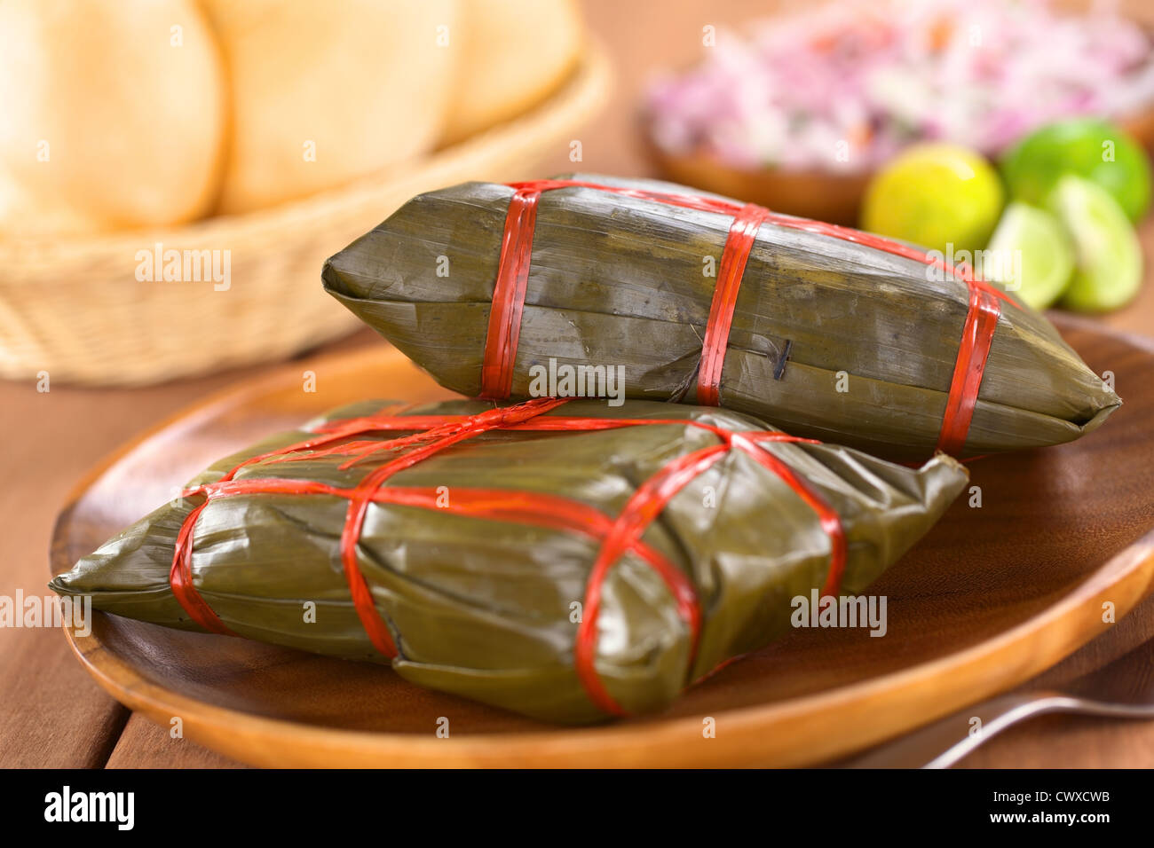 Peruvian tamales wrapped in banana leaves, in which they are cooked