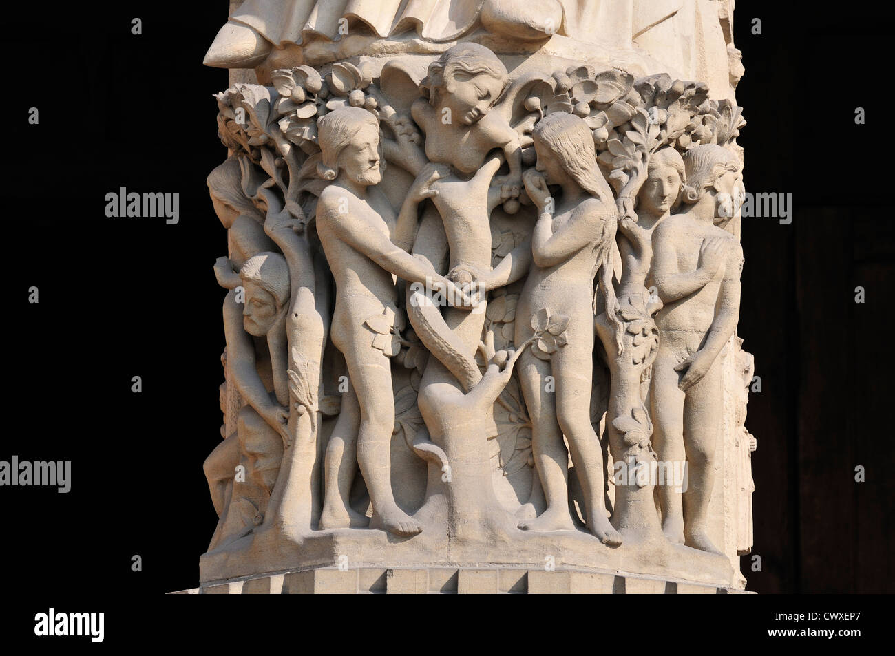 Paris, France. Notre Dame cathedral - facade detail. Adam, Eve eating the forbidden fruit and the serpent in the form of a woman Stock Photo