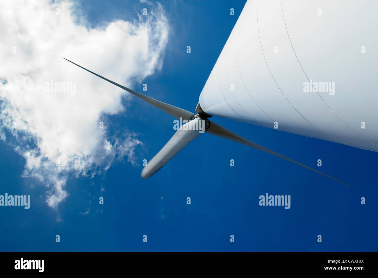 Wind turbine against a blue sky Stock Photo - Alamy
