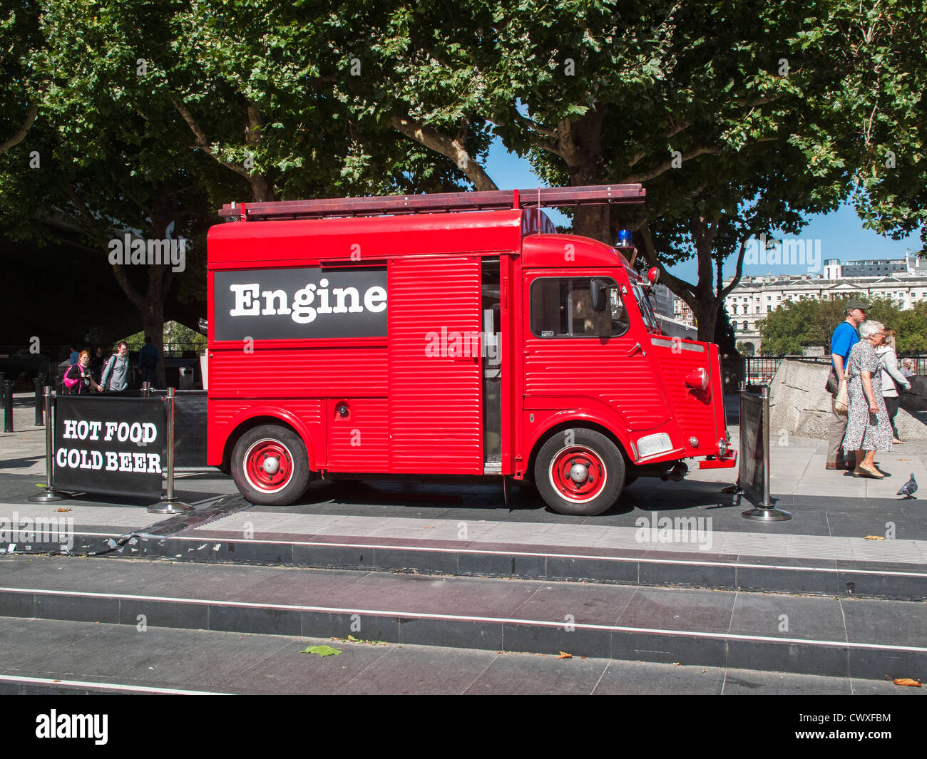 Food van in the form of a fire engine outside the National Theatre, South Bank on the Embankment in London, England Stock Photo