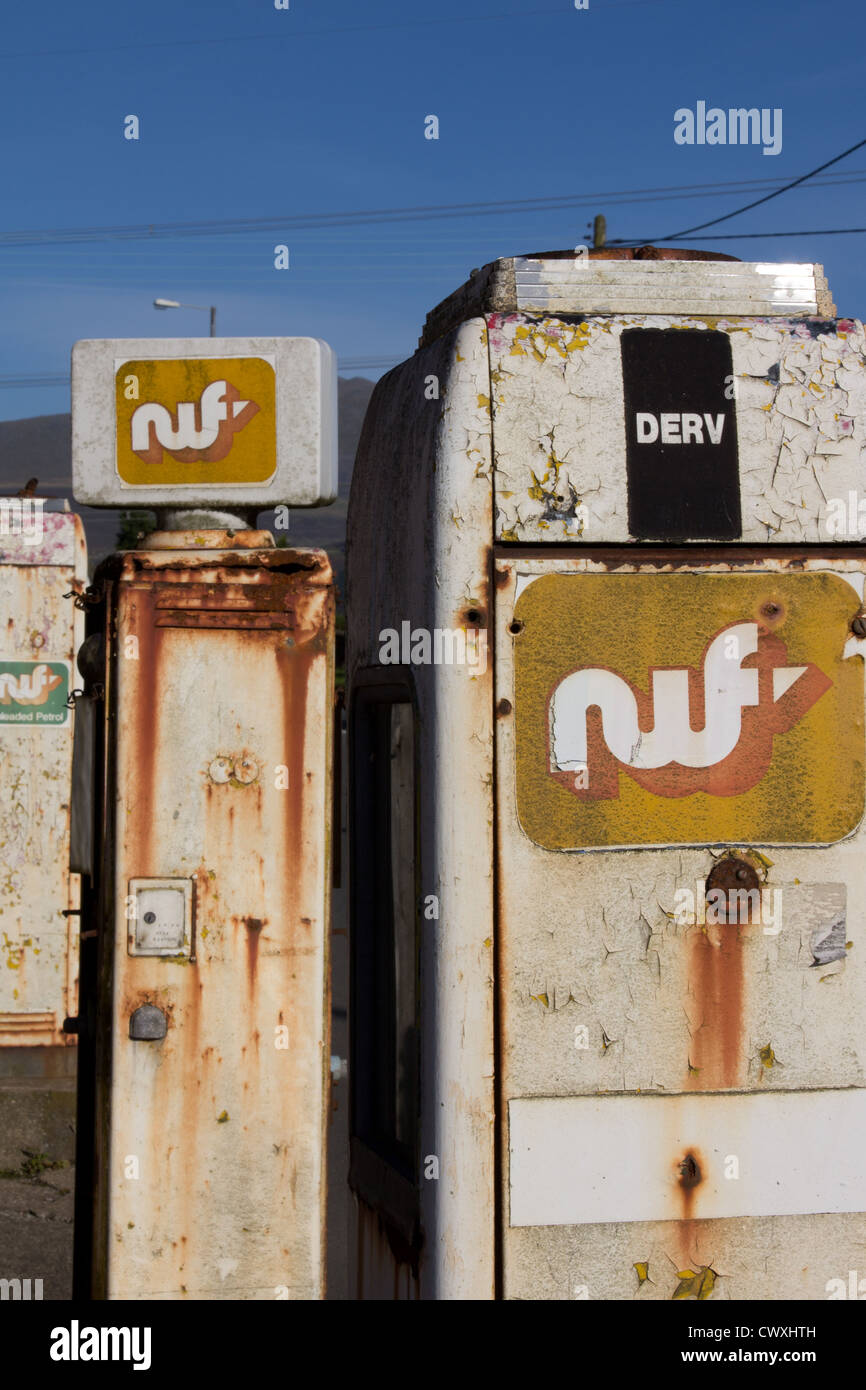 Disused rusty garage and fuel pumps at Llanrug, Snowdonia National Park. Stock Photo