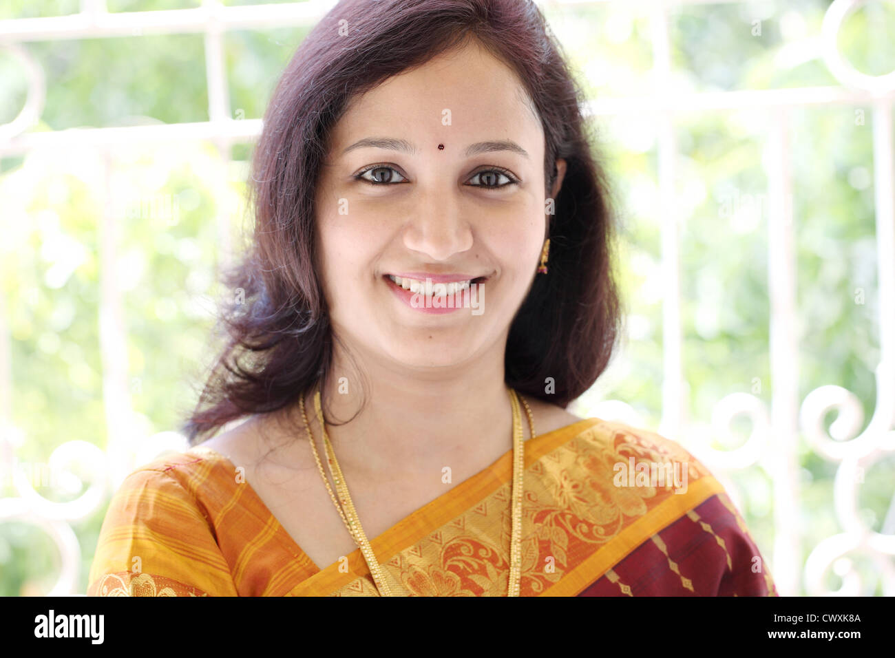 Portrait of smiling young Indian traditional woman Stock Photo - Alamy