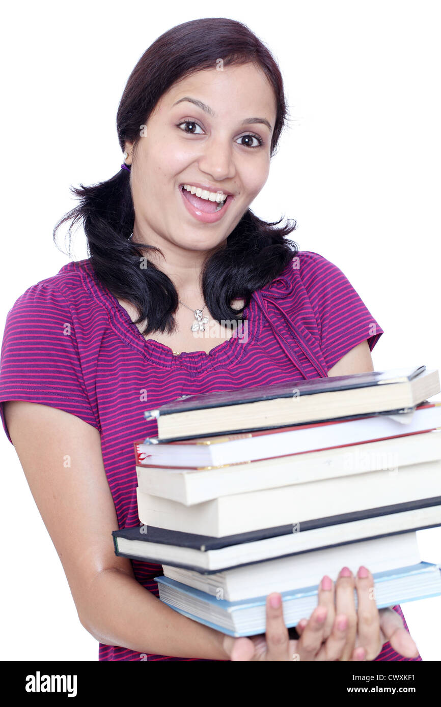 Happy young female student holding stack of books Stock Photo - Alamy