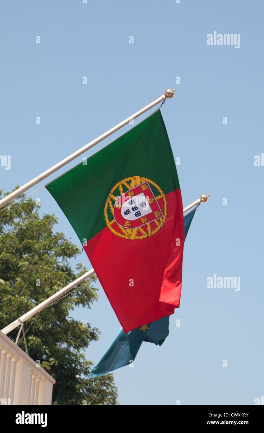 The Portuguese flag outside the Embassy of Portugal on Belgrave Square, Belgravia, London, UK. Stock Photo