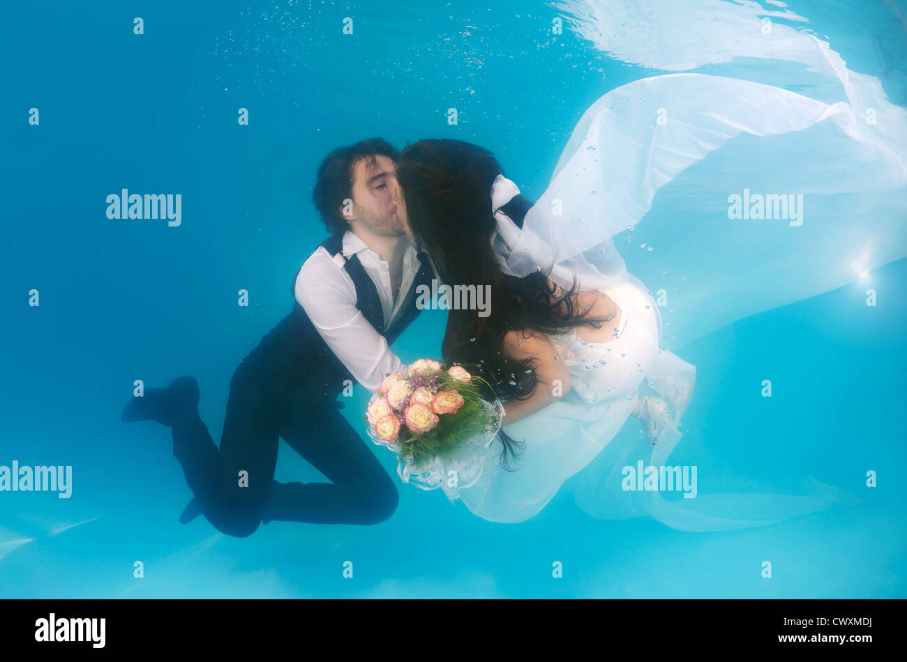 Bridal couple, underwater wedding in pool, Odessa, Ukraine, Eastern Europe Stock Photo