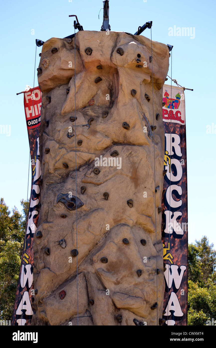 Portable rock wall climbing at a school fete / fair Stock Photo - Alamy