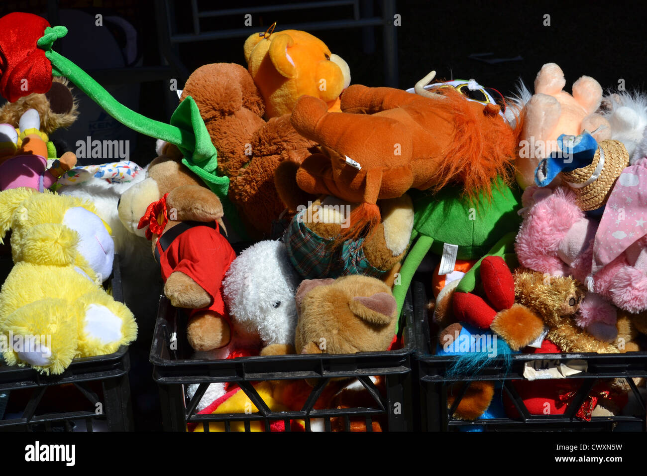 crates full of stuffed animals and plush toys at flea market Stock Photo -  Alamy