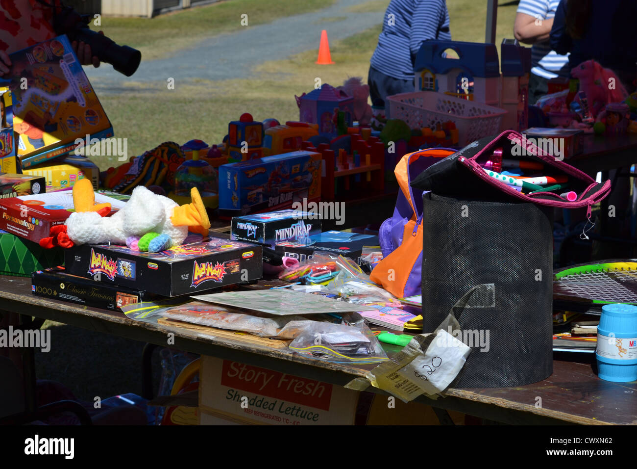 Random board games and plush toys and other toys a table at flea market